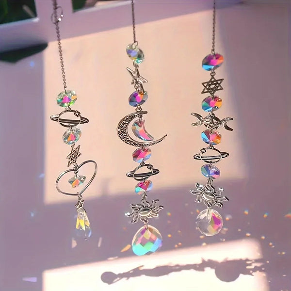 A set of crystal moon and sun wind chimes featuring various celestial shapes and iridescent beads.