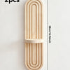 Two wooden wall shelves with arched grooves made of light wood.