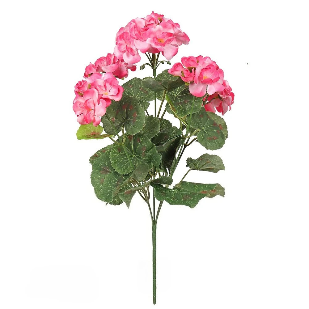A bouquet of pink artificial geranium flowers with green leaves.