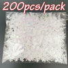 A clear plastic bag containing 200 pieces of white frosted snowflake confetti for holiday decorations.