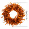 An artificial autumn colored eucalyptus wreath with a wire frame and a measurement of 40cm x 15.74in.
