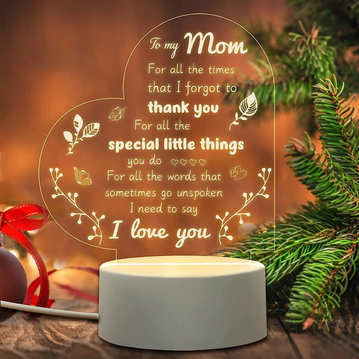 A warm glow night light featuring a heart shape with text that reads I love you to Mom