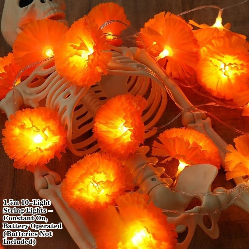 Orange LED marigold string lights illuminating a white plastic fan-shaped holder for festive decor