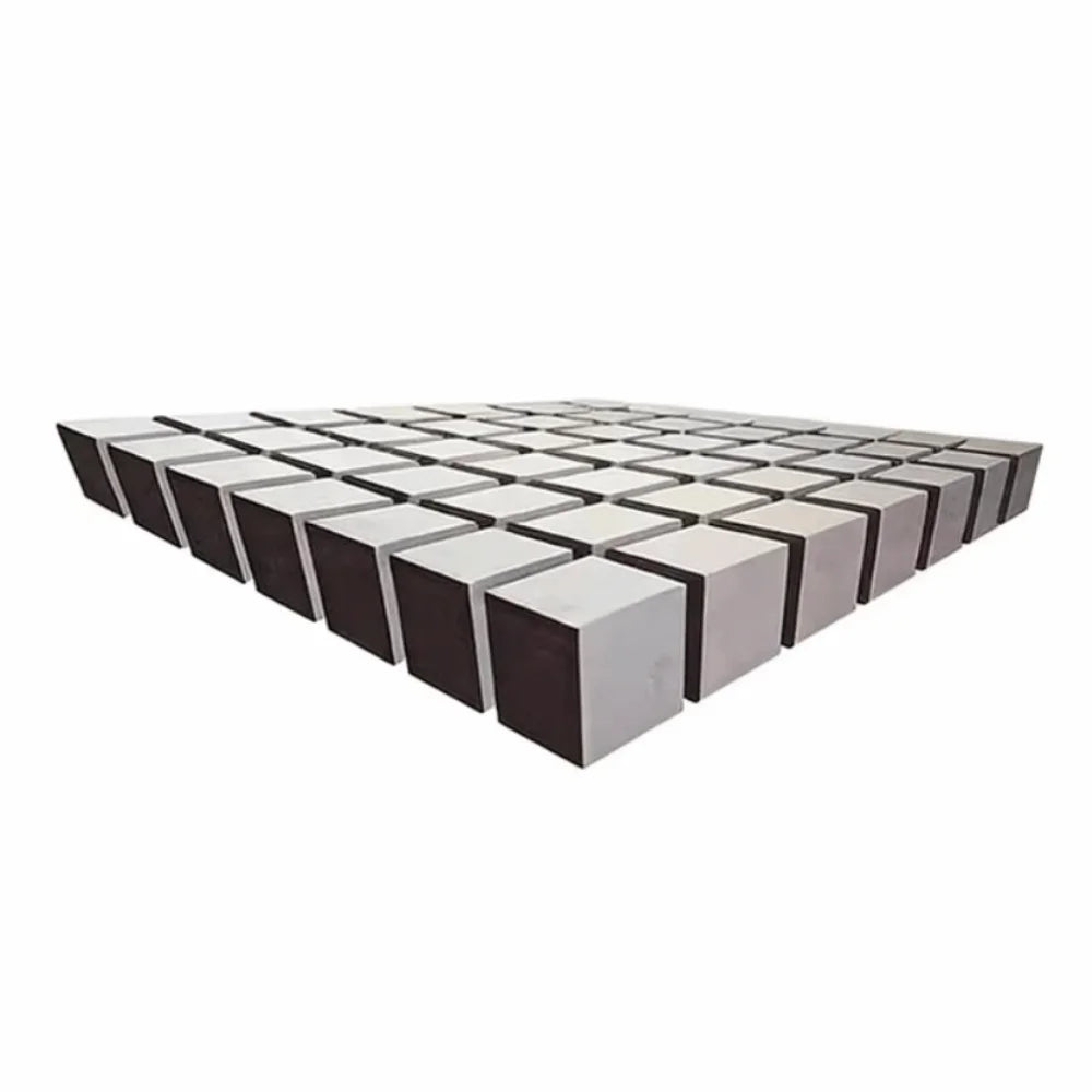 A grid of dark and light cubes forming an optical illusion maze pattern on a wall.