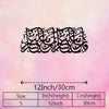 Black Arabic calligraphy artwork on a pink background with a scale bar showing 12 inches or 30 cm height.