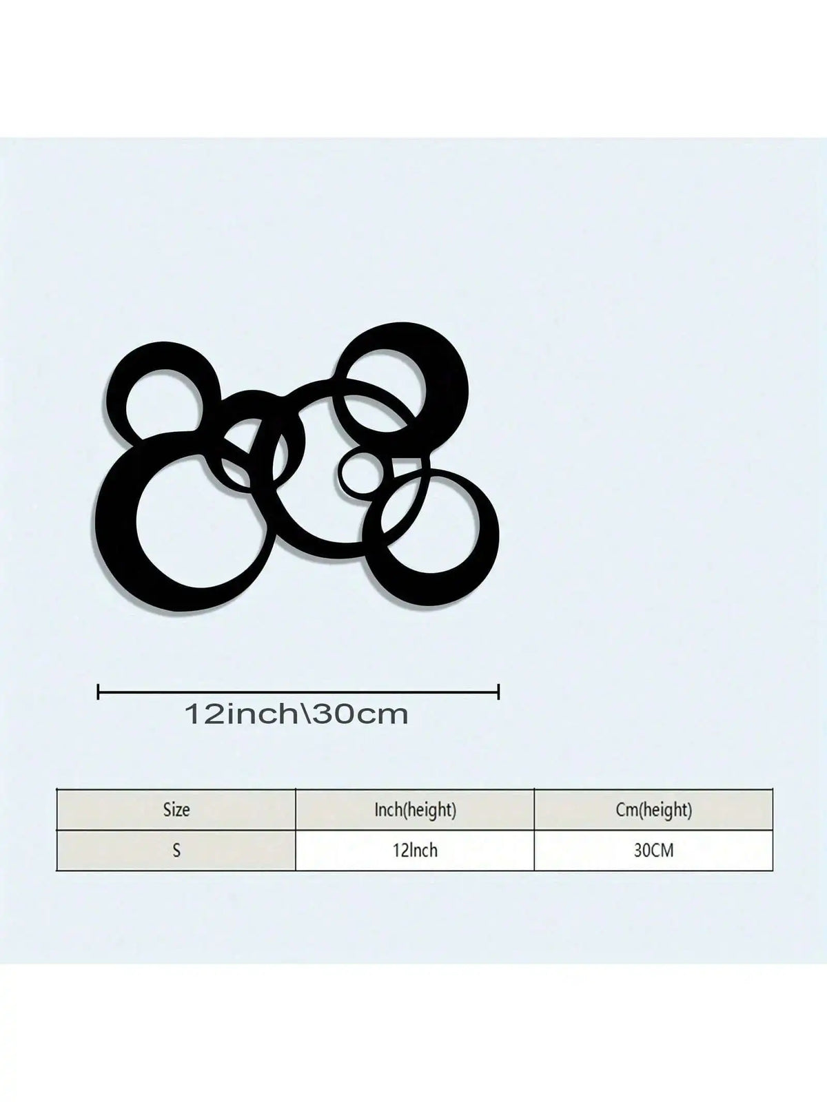 Black metal wall decor featuring interconnected circular shapes.