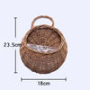 Woven brown basket with a clear plastic bag inside, shown with dimensions 23.5cm high and 18cm wide.