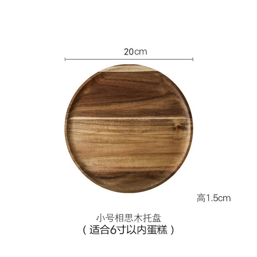 A round wooden cake tray with a glass dome cover, measuring 20cm in diameter and 1.5cm high.