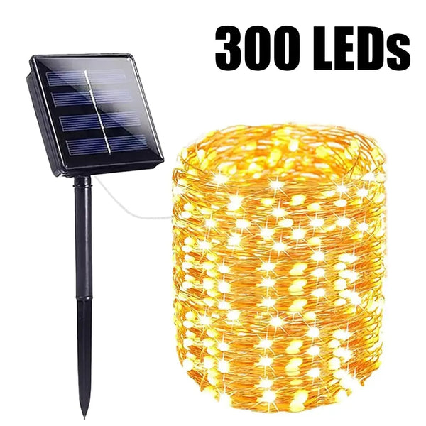 A bundle of 300 yellow LED fairy string lights and a solar panel with a stand.
