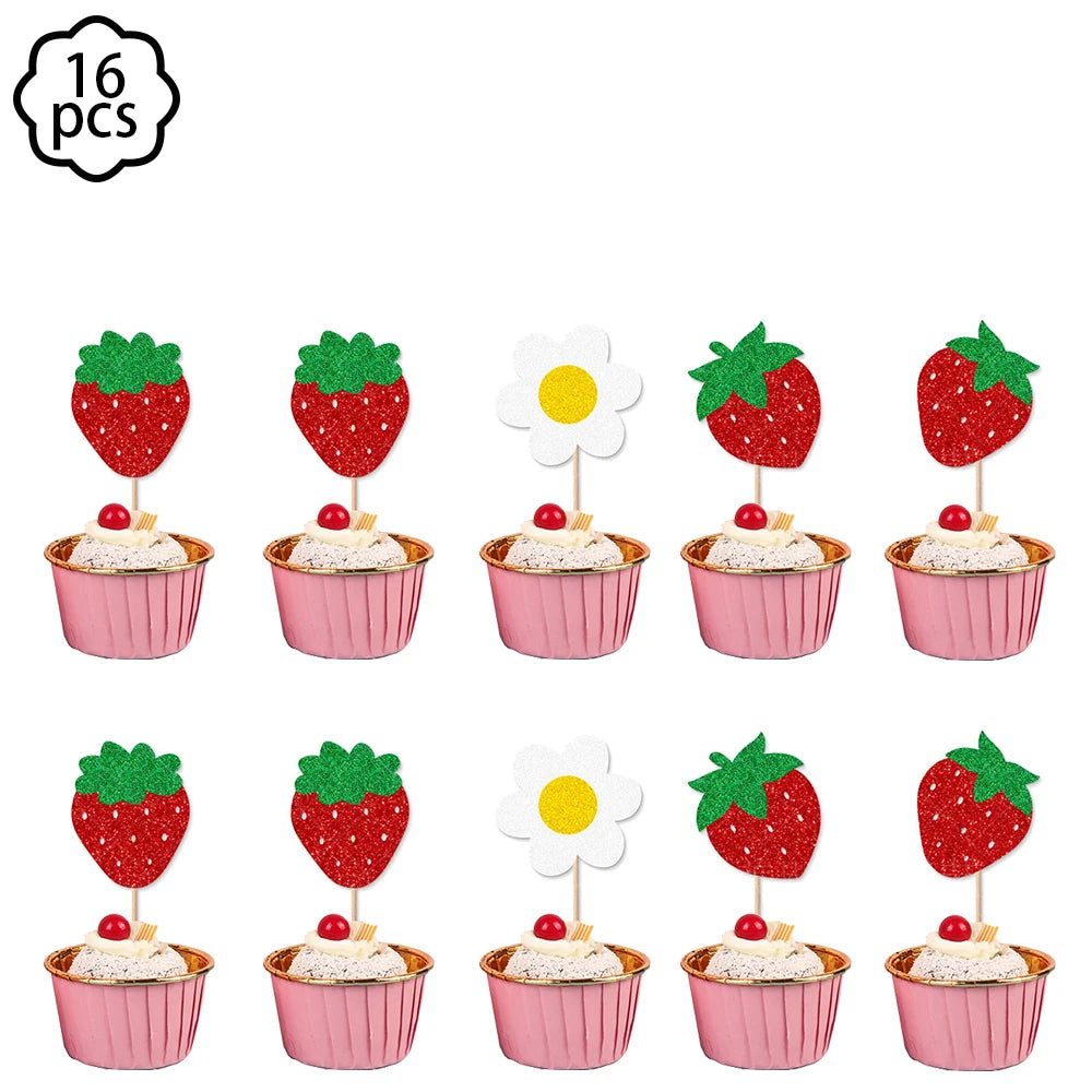 A set of pink plates, cups, napkins, and a tablecloth for a strawberry party supplies kit.