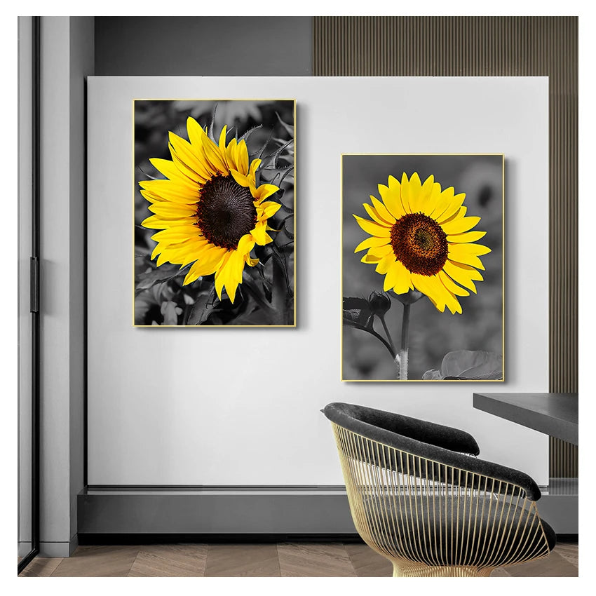 A framed print of a vibrant yellow sunflower against a dark background, displayed on a white wall.
