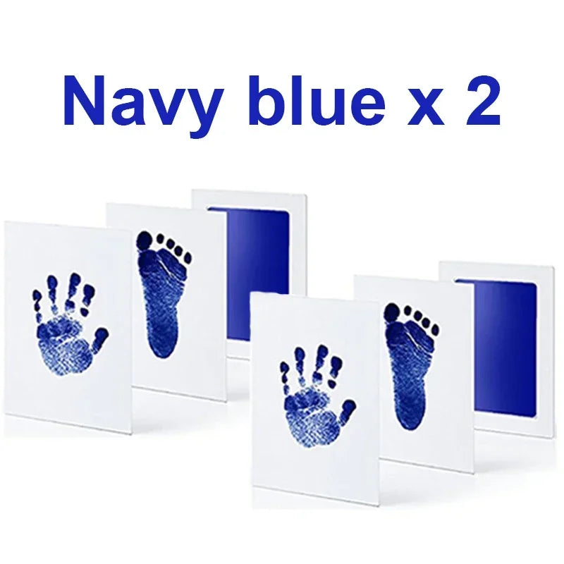 Two navy blue handprint and footprint ink pads displayed on white cards.