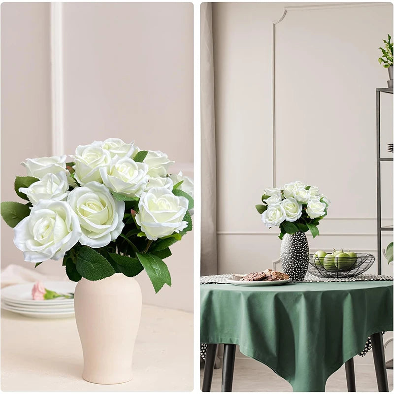 A bouquet of white artificial silk roses in a light pink vase on a table.