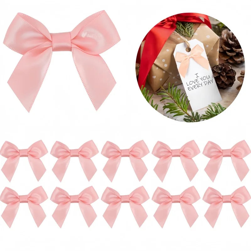 A collection of pink satin ribbon bows with self-adhesive backing shown in various sizes and styles.