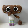 A brown plush toy resembling a character with large eyes and a white outfit.