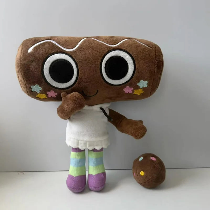 A brown plush toy resembling a character with large eyes and a white outfit, holding a small brown object.