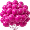 A cluster of bright pink latex balloons tied together for party decorations.