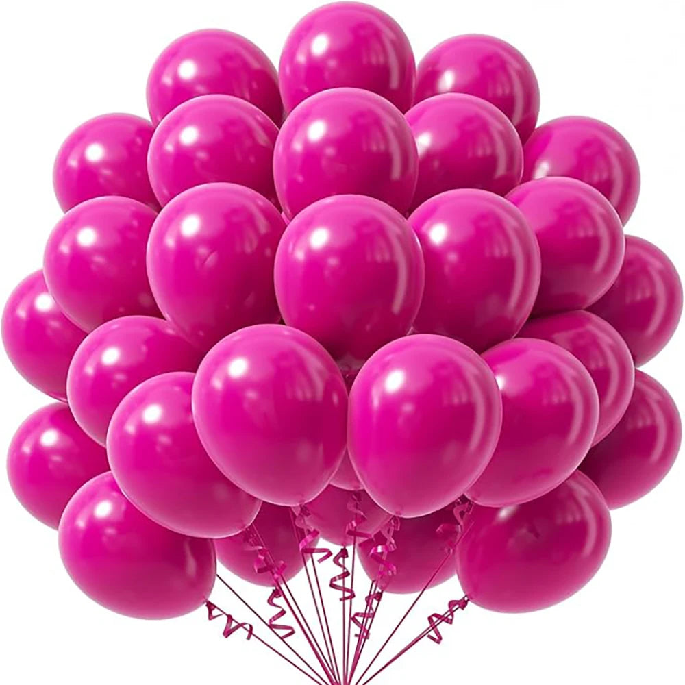 A cluster of bright pink latex balloons tied together for party decorations.