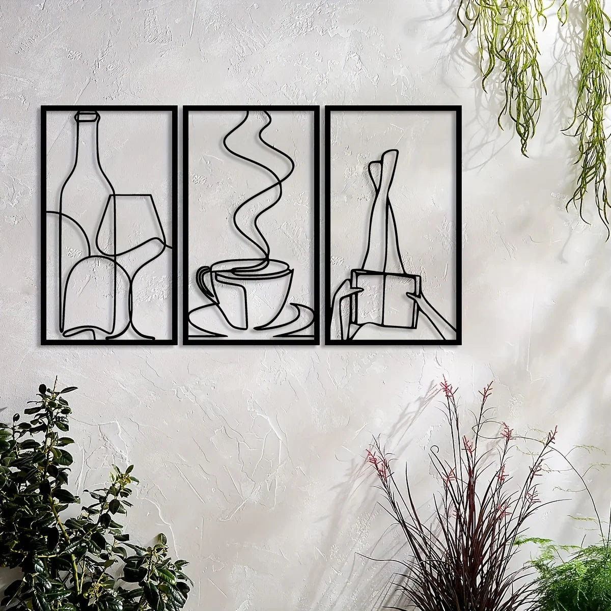 Three framed minimalist metal wall art pieces depicting bottles, a steaming cup, and a stylized figure.