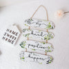 Rustic wooden inspirational hanging sign with phrases like Dream big Work hard Stay positive and Make it happen
