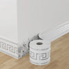 Roll of white self-adhesive PVC baseboard trim featuring a gray brick pattern on a wooden floor.