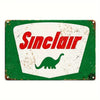 Vintage metal tin sign with a white background and red text reading Sinclair and a green dinosaur silhouette.