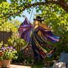 Acrylic hanging suncatcher of a dancing lady with purple and gold wings suspended from a branch.