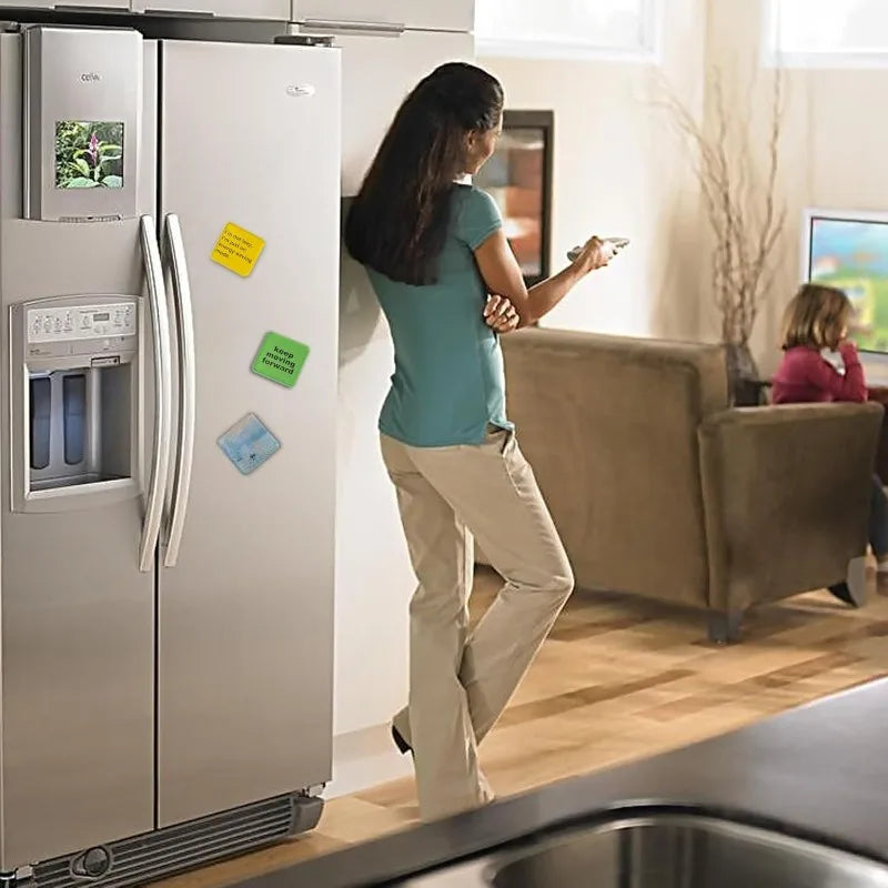 A woman is preparing to use a DIY acrylic fridge magnet making kit in a modern kitchen setting.
