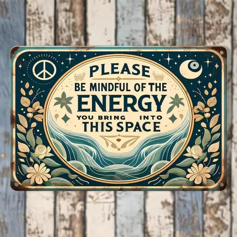 A vintage metal wall sign with a dark teal background featuring a peace symbol, moon, and text reminding viewers to be mindfu