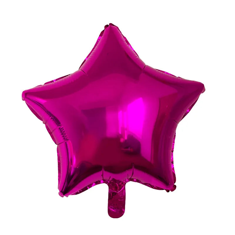 A single, shiny magenta foil balloon shaped like a star.