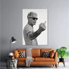 A black and white photograph of an older man pointing, displayed as wall art.