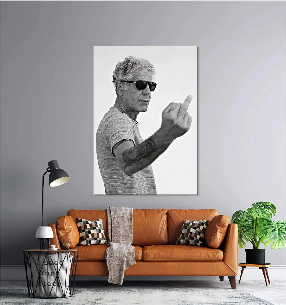 A black and white photograph of an older man pointing, displayed as wall art.