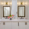 Modern bubble crystal LED wall sconces above a kitchen vanity with mirrors and white cabinetry
