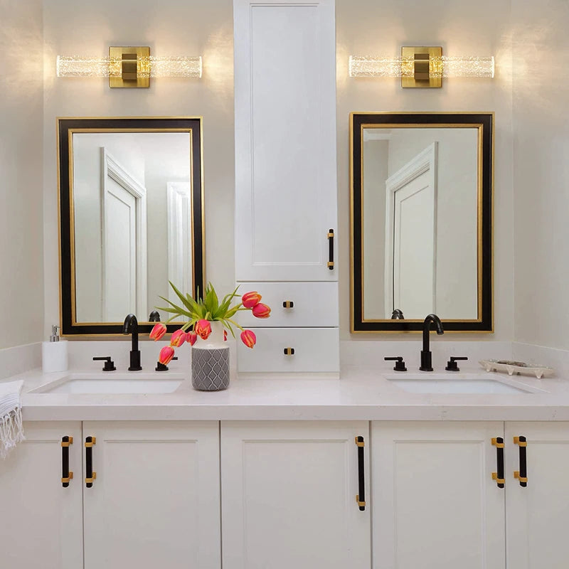 Modern bubble crystal LED wall sconces above a kitchen vanity with mirrors and white cabinetry
