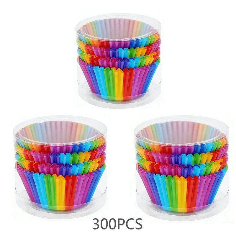 A bulk pack of colorful rainbow disposable cupcake liners in a clear plastic container.
