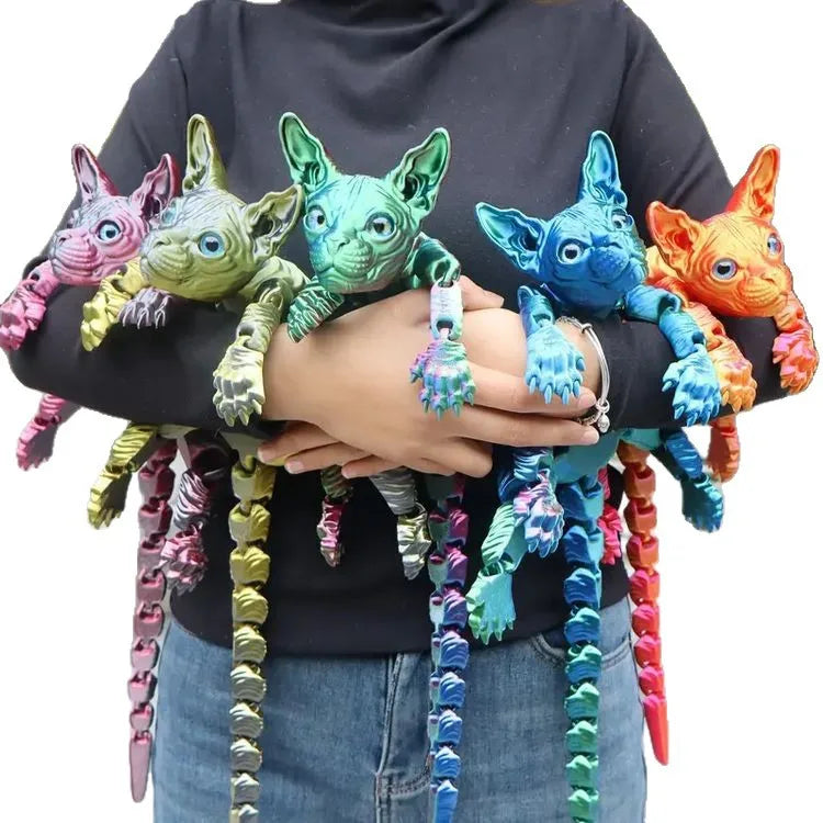 A hand holds a collection of realistic Sphynx cat fidget toys in various colors and textures.