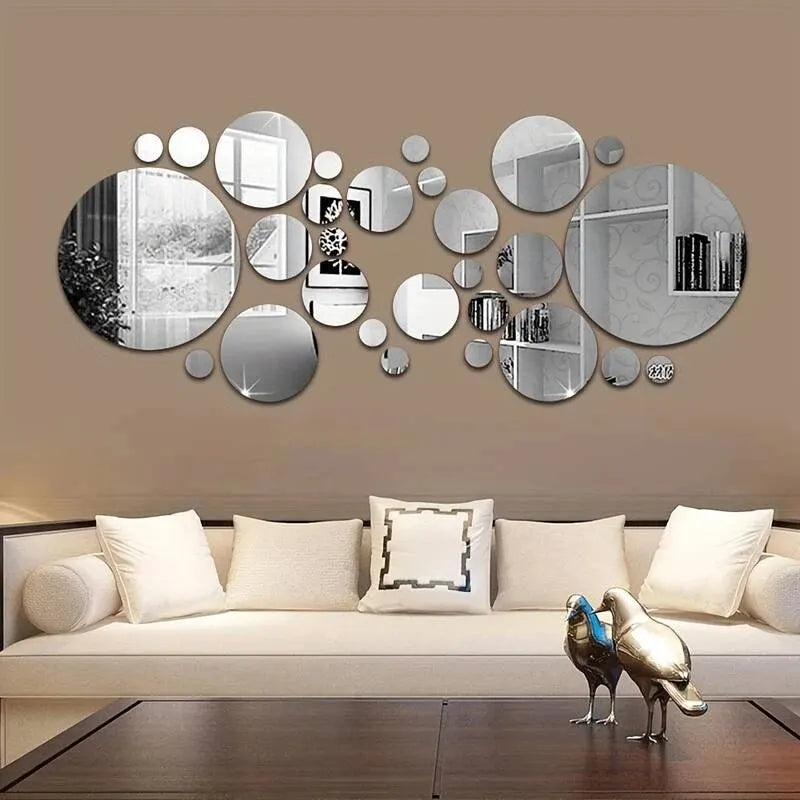 A wall decor set featuring various circular and oval 3D acrylic mirrors in silver and black tones.