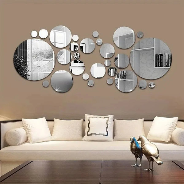 A wall decor set featuring various circular and oval 3D acrylic mirrors in silver and black tones.