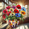 A glass flower pot filled with colorful acrylic flowers hangs as a sun catcher ornament in a window light.