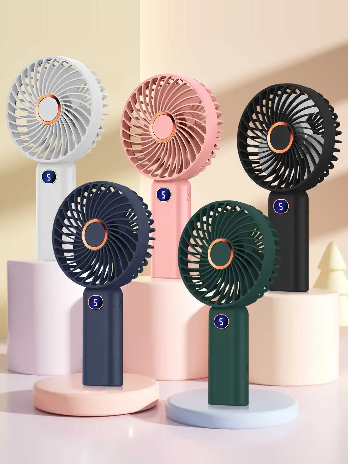A collection of five portable rechargeable handheld fans in various colors and designs displayed on a white surface.