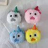 Four pastel-colored plush toys with conical hats, including white, pink, blue, and yellow.