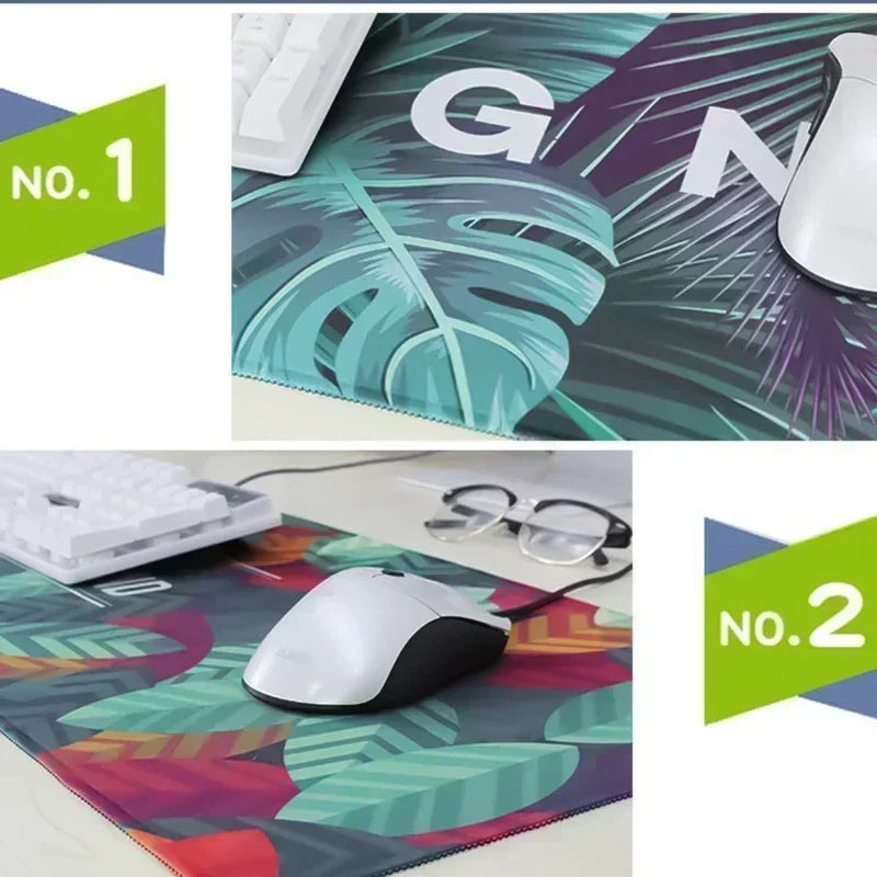 Desk mat featuring a tropical leaf pattern with a white mechanical keyboard and a white computer mouse.