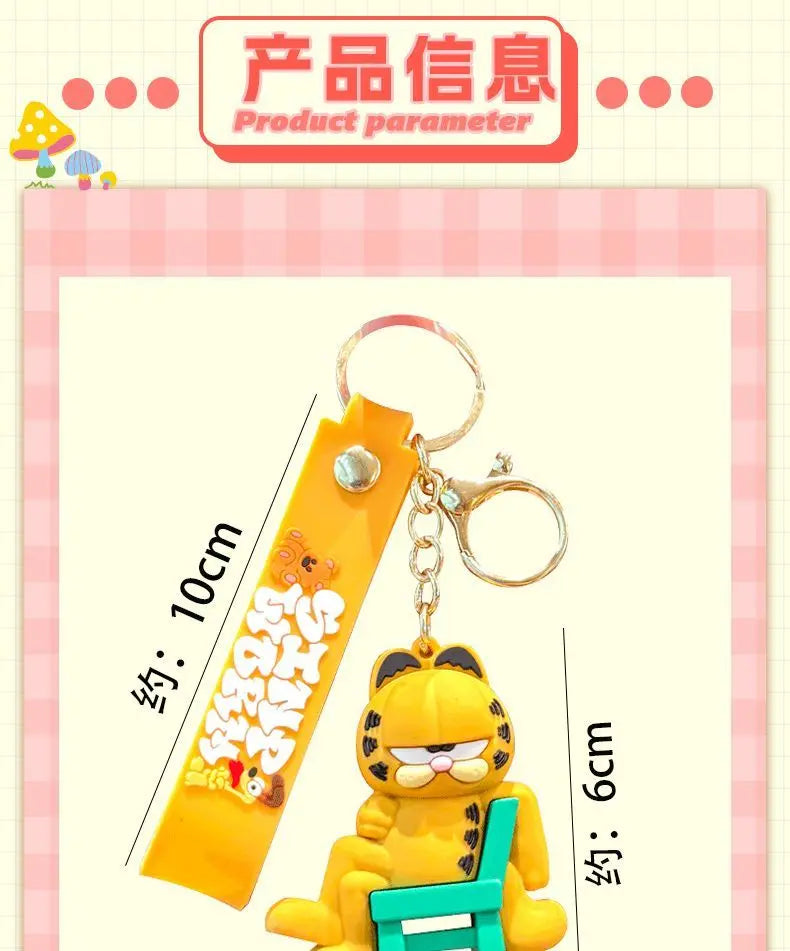 A yellow cartoon cat pendant keychain featuring the Garfield character on a gold-colored tag.