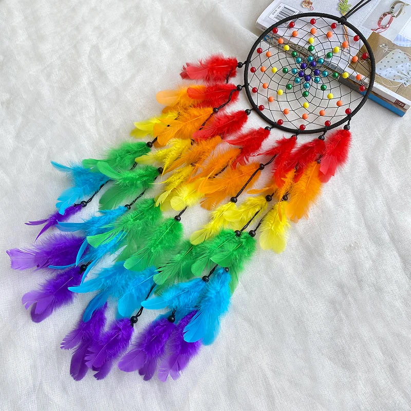 A colorful feather dream catcher wind chime pendant featuring vibrant feathers in red, orange, yellow, green, and blue.