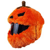An orange cartoon plush helmet cover designed to resemble a grinning pumpkin face.