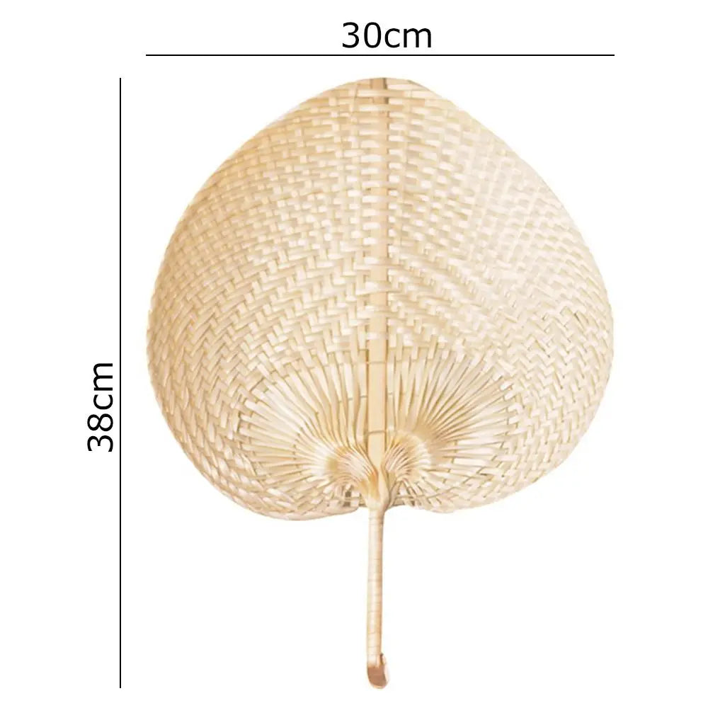 A light beige peach-shaped bamboo woven hand fan with a long handle.