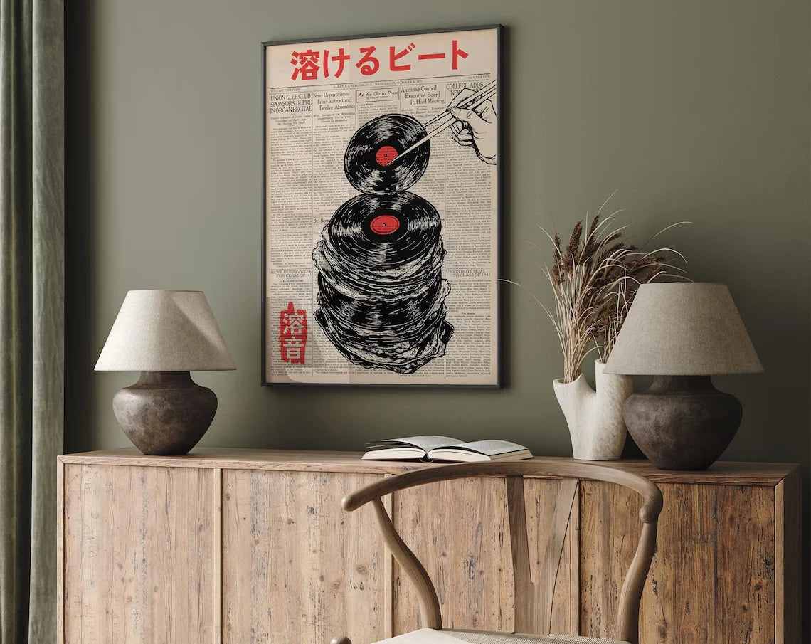 A framed poster featuring a black and white illustration of a hand dropping a needle onto a vinyl record, titled '溶けるピート' (Me