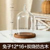Glass aromatherapy candle holder with a clear dome and a wooden base for dust-proof storage