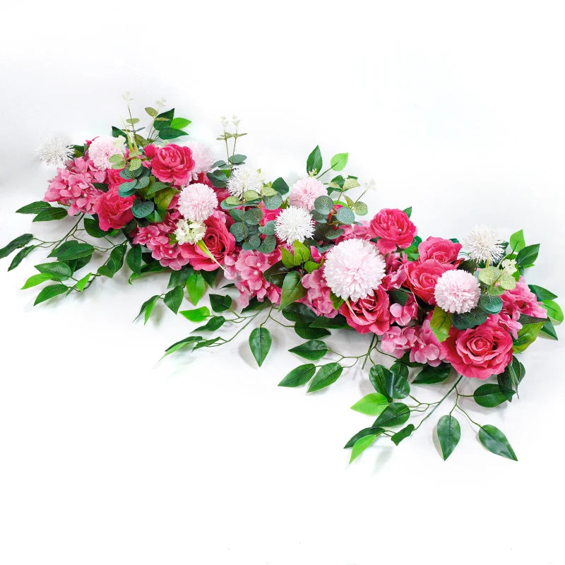 A lush arrangement of pink and white artificial roses and greenery for event decor.