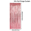 A vertical curtain made of pink foil fringe with a glitter texture.